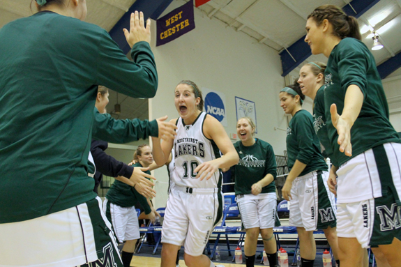 Photo by Ethan Magoc: Mercyhurst College senior Samantha Loadman yells as she high fives teammates during pregame introductions before a game against Clarion University on Wednesday, Jan. 19, 2011, at the Mercyhurst Athletic Center.